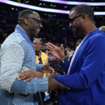 
              Former NFL player Shannon Sharpe, left, talks with Tee Morant, father of Memphis Grizzlies guard Ja Morant, after an NBA basketball game against the Los Angeles Lakers in Los Angeles, Friday, Jan. 20, 2023. At halftime, Sharpe confronted Memphis Grizzlies forward Dillon Brooks and center Steven Adams. (AP Photo/Ashley Landis)
            