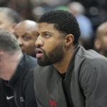 
              Los Angeles Clippers guard Paul George watches from the bench during the first half of the team's NBA basketball game against the Utah Jazz on Wednesday, Jan. 18, 2023, in Salt Lake City. (AP Photo/Rick Bowmer)
            
