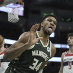 
              Milwaukee Bucks' Giannis Antetokounmpo reacts after making a basket during the first half of an NBA basketball game Tuesday, Jan. 3, 2023, in Milwaukee. (AP Photo/Morry Gash)
            
