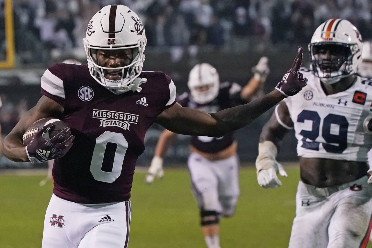 FILE - Then-Mississippi State wide receiver Rara Thomas (0) smiles after catching a pass for a touc...
