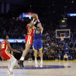 
              Golden State Warriors guard Klay Thompson (11) shoots against Atlanta Hawks guard Dejounte Murray (5) during the second half of an NBA basketball game in San Francisco, Monday, Jan. 2, 2023. (AP Photo/Jed Jacobsohn)
            