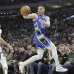 
              Milwaukee Bucks' Pat Connaughton saves the ball in front of Denver Nuggets' Aaron Gordon during the first half of an NBA basketball game Wednesday, Jan. 25, 2023, in Milwaukee. (AP Photo/Morry Gash)
            