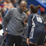 
              Georgetown head coach James Howard, left, talks with Kennedy Fauntleroy (10) in the second half of an NCAA college basketball game against UConn, Sunday, Jan. 15, 2023, in Hartford, Conn. (AP Photo/Jessica Hill)
            