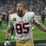 
              San Francisco 49ers tight end George Kittle (85) celebrates after their victory over the Las Vegas Raiders in an NFL football game between the San Francisco 49ers and Las Vegas Raiders, Sunday, Jan. 1, 2023, in Las Vegas. The 49ers defeated the Raiders 37-34 in overtime. (AP Photo/John Locher)
            