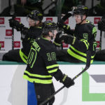 
              Dallas Stars' Ty Dellandrea (10) celebrates with the bench after scoring in the first period of an NHL hockey game against the New Jersey Devils, Friday, Jan. 27, 2023, in Dallas. (AP Photo/Tony Gutierrez)
            