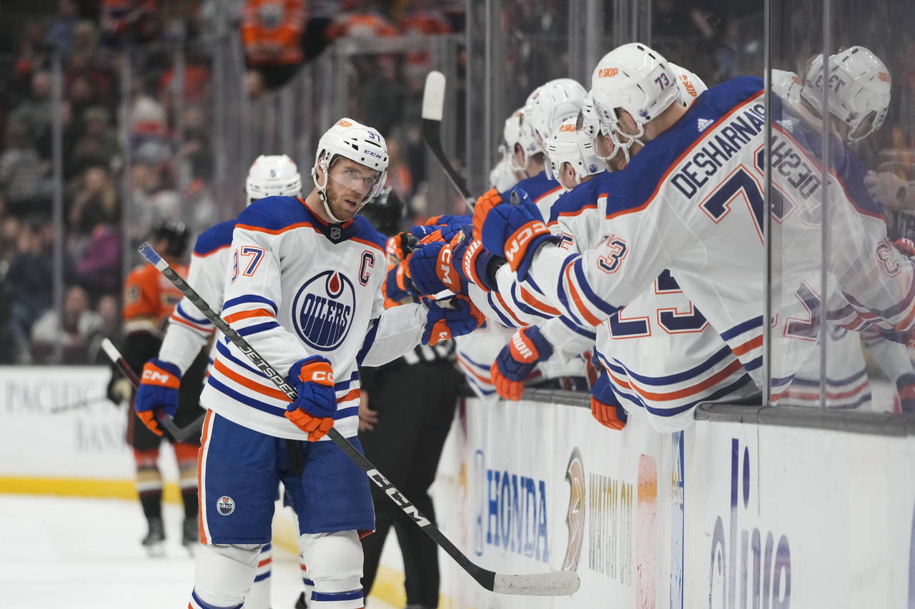 Edmonton Oilers' Connor McDavid (97) is congratulated for his goal during the first period of the t...