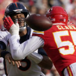 
              Denver Broncos quarterback Russell Wilson, left, is hit by Kansas City Chiefs defensive end Frank Clark (55) while throwing during the first half of an NFL football game Sunday, Jan. 1, 2023, in Kansas City, Mo. (AP Photo/Ed Zurga)
            