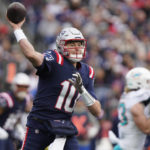 
              New England Patriots quarterback Mac Jones (10) throws a pass during the first half of an NFL football game against the Miami Dolphins, Sunday, Jan. 1, 2023, in Foxborough, Mass. (AP Photo/Steven Senne)
            