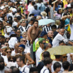 
              People line up to pay their last respects to the late Brazilian soccer great Pele during his wake at Vila Belmiro stadium in Santos, Brazil, Monday, Jan. 2, 2023. (AP Photo/Matias Delacroix)
            