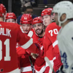 
              Detroit Red Wings center Robby Fabbri, third from right, celebrates his goal against the Toronto Maple Leafs in the second period of an NHL hockey game Thursday, Jan. 12, 2023, in Detroit. (AP Photo/Paul Sancya)
            