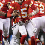 
              Cincinnati Bengals defensive end Cam Sample tackles Kansas City Chiefs quarterback Patrick Mahomes (15) during the first half of the NFL AFC Championship playoff football game, Sunday, Jan. 29, 2023, in Kansas City, Mo. (AP Photo/Charlie Riedel)
            