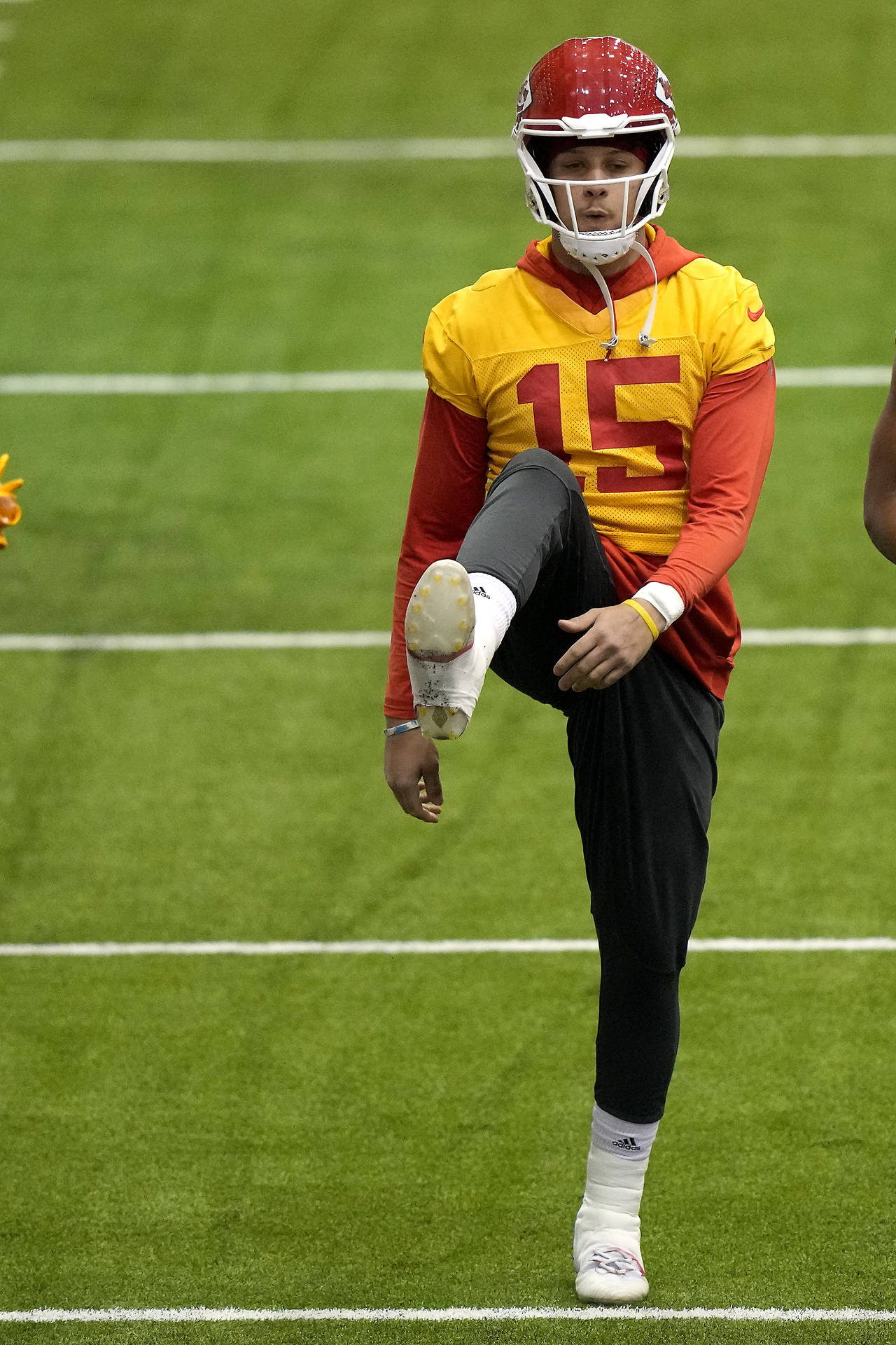 Kansas City Chiefs quarterback Patrick Mahomes stretches runs during an NFL football workout Thursd...