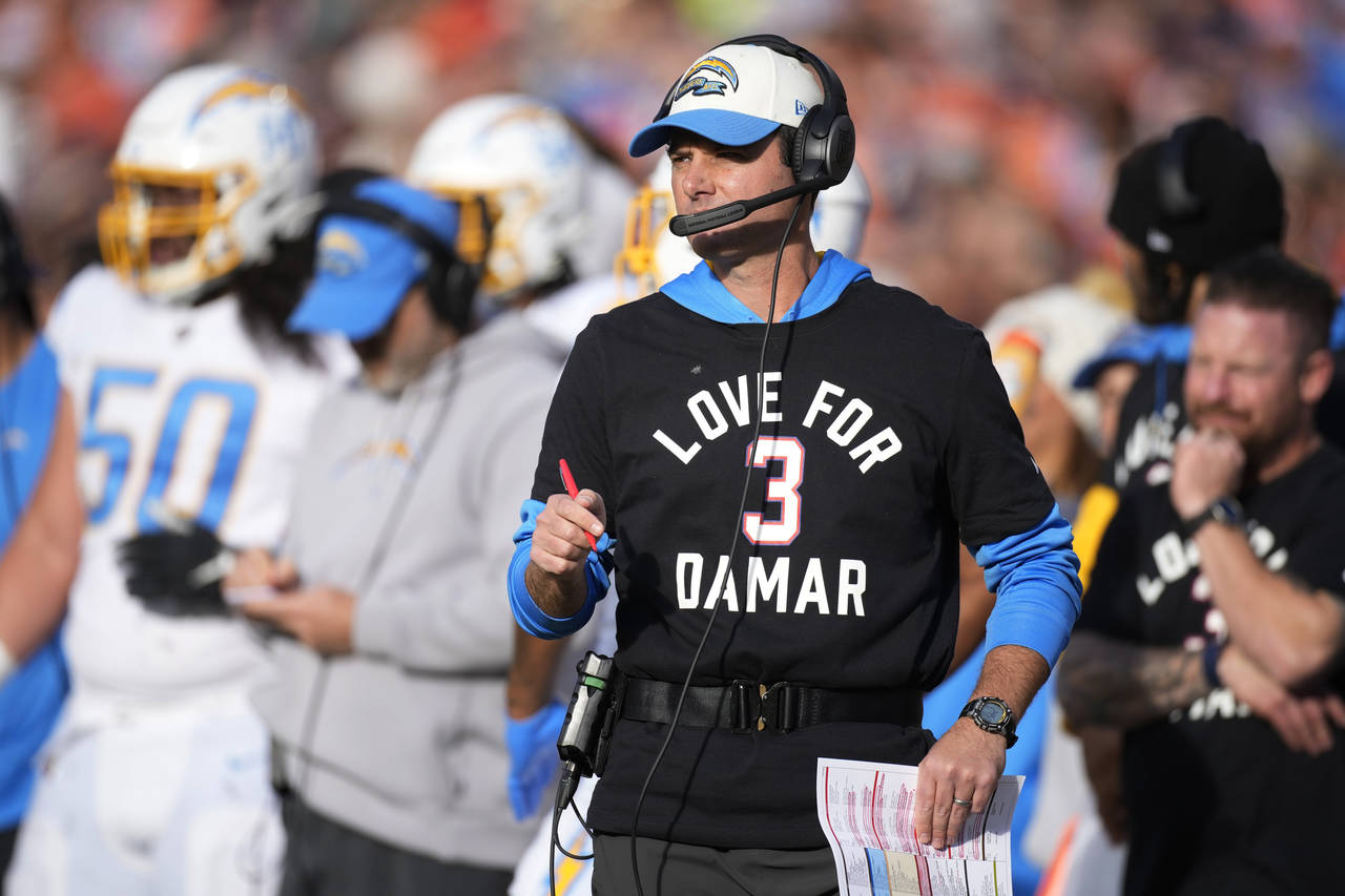 Los Angeles Chargers head coach Brandon Staley wears a T-shirt to show support for Buffalo Bills sa...