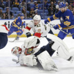 
              Florida Panthers goaltender Sergei Bobrovsky falls while blocking a shot during the first period of an NHL hockey game against the Buffalo Sabres on Monday, Jan. 16, 2023, in Buffalo, N.Y. (AP Photo/Joshua Bessex)
            