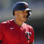 
              FILE - Minnesota Twins' Carlos Correa reacts while batting during the first inning of a baseball game against the Chicago White Sox, Thursday, Sept. 29, 2022, in Minneapolis. Carlos Correa reversed course for a second time, agreeing Tuesday to a $200 million, six-year contract that keeps him with the Minnesota Twins after failing to complete agreements with the New York Mets and San Francisco Giants, a person familiar with the negotiations told The Associated Press on Tuesday, Jan. 10, 2023. (AP Photo/Abbie Parr, File)
            