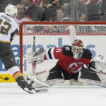 
              New Jersey Devils goaltender Vitek Vanecek (41) tends the net against Vegas Golden Knights right wing Michael Amadio (22) during the second period of an NHL hockey game, Tuesday, Jan. 24, 2023, in Newark, N.J. (AP Photo/Mary Altaffer)
            
