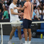 
              Alexei Popyrin of Australia is congratulated by Taylor Fritz, left, of the U.S. following their second round match at the Australian Open tennis championship in Melbourne, Australia, Thursday, Jan. 19, 2023. (AP Photo/Aaron Favila)
            