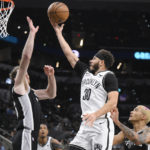 
              Brooklyn Nets' Seth Curry (30) goes to the basket against San Antonio Spurs' Jakob Poeltl during the first half of an NBA basketball game Tuesday, Jan. 17, 2023, in San Antonio. (AP Photo/Darren Abate)
            