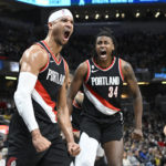 
              Portland Trail Blazers guard Josh Hart, left, celebrates after a dunk during the second half of an NBA basketball game against the Indiana Pacers, Friday, Jan. 6, 2023, in Indianapolis. (AP Photo/Marc Lebryk)
            