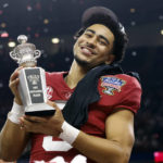 
              Alabama quarterback Bryce Young holds the Most Outstanding Player trophy as he celebrates after the Sugar Bowl NCAA college football game where Alabama defeated Kansas State 45-20, Saturday, Dec. 31, 2022, in New Orleans. (AP Photo/Butch Dill)
            