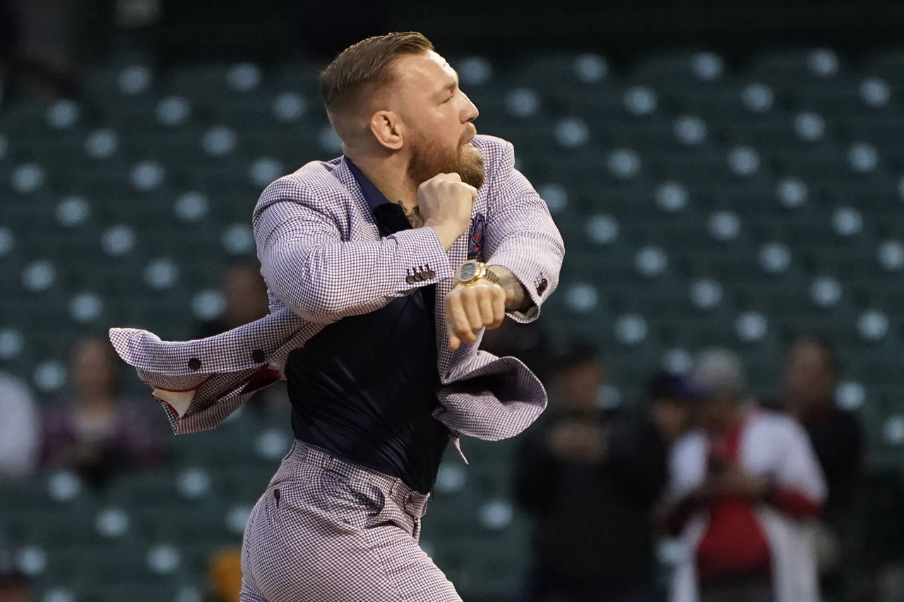 FILE - MMA fighter Conor McGregor throws out a ceremonial first pitch before a baseball game on Sep...
