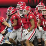 
              Georgia quarterback Stetson Bennett (13) celebrates hos touchdown against TCU during the first half of the national championship NCAA College Football Playoff game, Monday, Jan. 9, 2023, in Inglewood, Calif. (AP Photo/Ashley Landis)
            