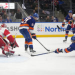 
              New York Islanders' Anders Lee (27) shoots the puck past Detroit Red Wings goaltender Magnus Hellberg (45) for a goal as teammate Kyle Palmieri (21) watches during the second period of an NHL hockey game Friday, Jan. 27, 2023, in Elmont, N.Y. (AP Photo/Frank Franklin II)
            