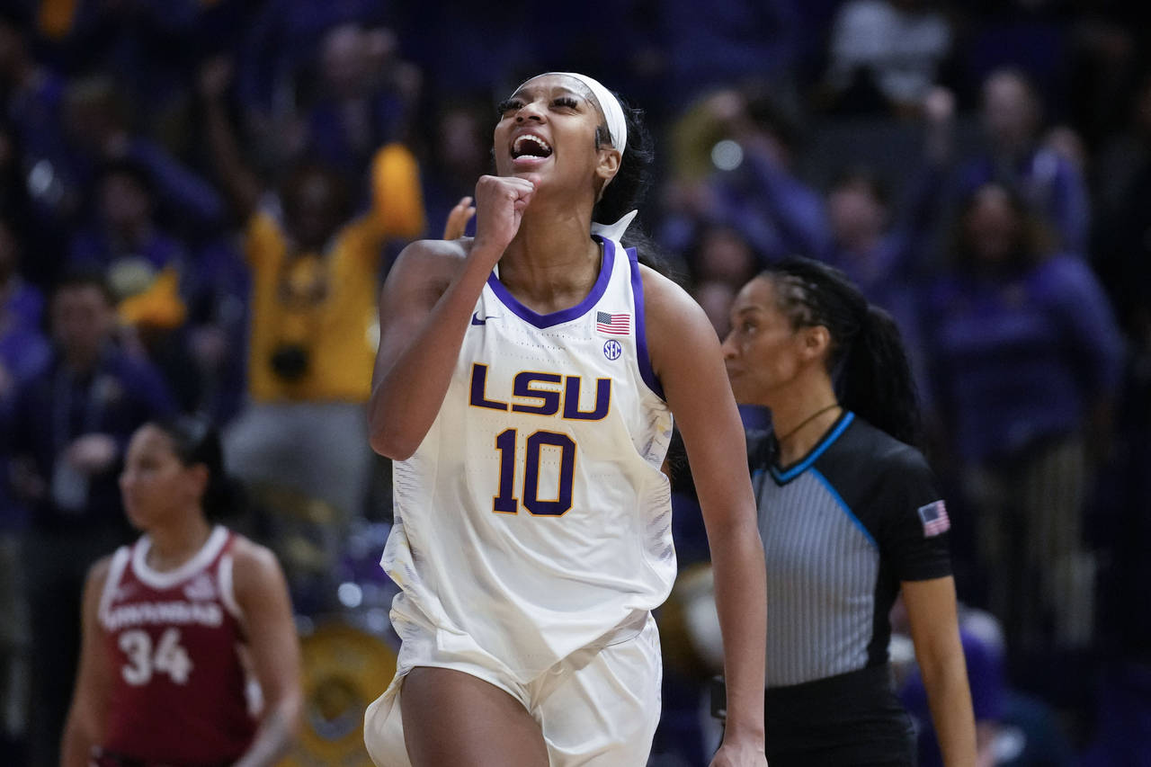 LSU forward Angel Reese (10) celebrates after a turnover in the second half an NCAA college basketb...