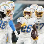 
              Los Angeles Chargers cornerback Asante Samuel Jr. (26) celebrates his interception against the Jacksonville Jaguars during the first of an NFL wild-card football game, Saturday, Jan. 14, 2023, in Jacksonville, Fla. (AP Photo/Chris Carlson)
            