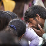 
              Bajrang Punia, Indian wrestler who won a Bronze medal at the 2020 Tokyo Olympics, right, speaks with other wrestlers during a protest against Wrestling Federation of India President Brijbhushan Sharan Singh and other officials in New Delhi, India, Friday, Jan. 20, 2023. Top India wrestlers led a protest near the parliament building accusing the federation president and coaches of sexually and mentally harassing young wrestlers. (AP Photo/Manish Swarup)
            