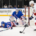 
              New York Rangers' Adam Fox (23) and goaltender Igor Shesterkin (31) protect the net as Florida Panthers' Aleksander Barkov (16) looks to pass the puck during the first period of an NHL hockey game Monday, Jan. 23, 2023, in New York. (AP Photo/Frank Franklin II)
            