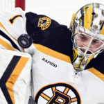 
              Boston Bruins goaltender Jeremy Swayman makes a save during the third period of an NHL hockey game against the Montreal Canadiens in Montreal, Tuesday, Jan. 24, 2023. (Graham Hughes/The Canadian Press via AP)
            