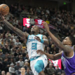 
              Charlotte Hornets guard Terry Rozier (3) goes to the basket as Utah Jazz forward Rudy Gay, right, defends during the second half of an NBA basketball game Monday, Jan. 23, 2023, in Salt Lake City. (AP Photo/Rick Bowmer)
            