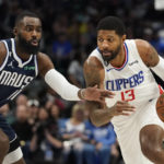 
              Los Angeles Clippers guard Paul George (13) drives against Dallas Mavericks forward Tim Hardaway Jr. (11) during the first quarter of an NBA basketball game in Dallas, Sunday, Jan. 22, 2023. (AP Photo/LM Otero)
            