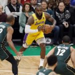 
              Los Angeles Lakers' LeBron James (6) passes off against Boston Celtics' Al Horford (42) and Grant Williams (12) during the first half of an NBA basketball game, Saturday, Jan. 28, 2023, in Boston. (AP Photo/Michael Dwyer)
            