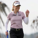 
              Brook Henderson waves to the gallery after sinking a birdie putt on the 18th green during the first round of the LPGA Hilton Grand Vacations Tournament of Champions Thursday, Jan. 19, 2023, in Orlando, Fla. (AP Photo/John Raoux)
            