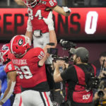 
              Georgia wide receiver Ladd McConkey (84) celebrates his touchdown against TCU during the first half of the national championship NCAA College Football Playoff game, Monday, Jan. 9, 2023, in Inglewood, Calif. (AP Photo/Ashley Landis)
            