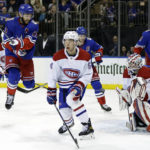 
              Montreal Canadiens goaltender Sam Montembeault, front right, defends against a shot as New York Rangers center Barclay Goodrow (21) jumps in the second period of an NHL hockey game Sunday, Jan. 15, 2023, in New York. (AP Photo/Adam Hunger)
            