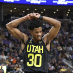 
              Utah Jazz guard Ochai Agbaji (30) reacts after a play against the Dallas Mavericks in the first half of an NBA basketball game Saturday, Jan. 28, 2023, in Salt Lake City. (AP Photo/Rob Gray)
            