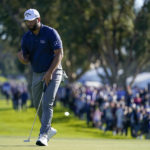 
              Jon Rahm, of Spain, reacts after making his putt for birdie on the 15th hole of the South Course at Torrey Pines during the third round of the Farmers Insurance Open golf tournament, Friday, Jan. 27, 2023, in San Diego. (AP Photo/Gregory Bull)
            