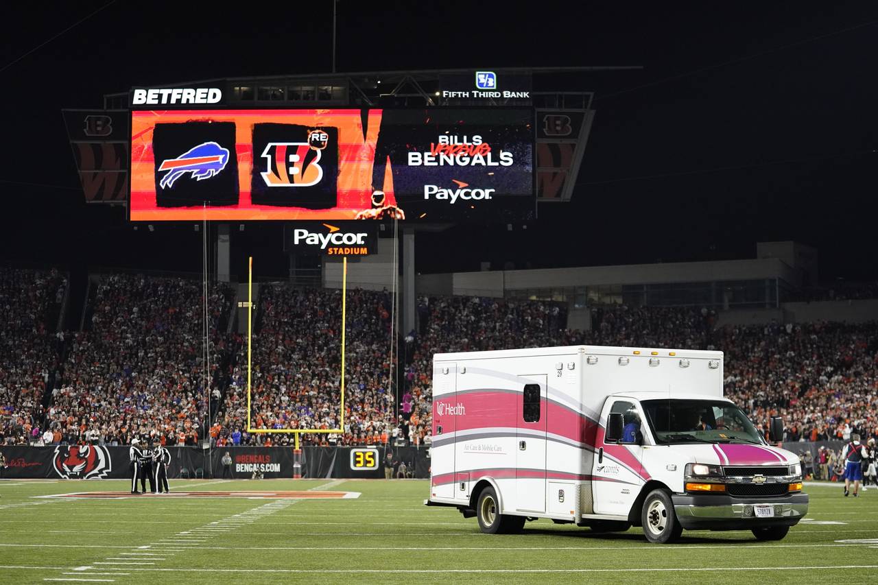 An ambulance leaves the field with Buffalo Bills' Damar Hamlin during the first half of an NFL foot...
