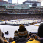 
              Fans watch as the Pittsburgh Penguins play the Boston Bruins during the first period of the NHL Winter Classic hockey game at Fenway Park, Monday, Jan. 2, 2023, in Boston. (AP Photo/Charles Krupa)
            