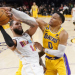
              Los Angeles Lakers guard Russell Westbrook, right, blocks the shot of Miami Heat forward Caleb Martin during the first half of an NBA basketball game Wednesday, Jan. 4, 2023, in Los Angeles. (AP Photo/Mark J. Terrill)
            
