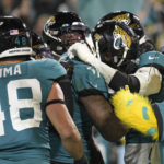 
              Jacksonville Jaguars linebacker Josh Allen (41) celebrates with teammates after returning a fumble for a touchdown in the second half of an NFL football game against the Tennessee Titans, Saturday, Jan. 7, 2023, in Jacksonville, Fla. (AP Photo/Phelan M. Ebenhack)
            