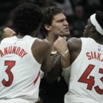 
              Milwaukee Bucks' Brook Lopez gets in a scuffle with with Toronto Raptors' Gary Trent Jr., O.G. Anunoby and Pascal Siakam during the second half of an NBA basketball game Tuesday, Jan. 17, 2023, in Milwaukee. Lopez was ejected from the game. The Bucks won 130-122. (AP Photo/Morry Gash)
            