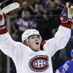 
              Montreal Canadiens right wing Cole Caufield reacts after scoring a goal against the New York Rangers in the third period of an NHL hockey game Sunday, Jan. 15, 2023, in New York. (AP Photo/Adam Hunger)
            