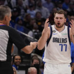 
              Dallas Mavericks guard Luka Doncic (77) questions a call by referee Scott Foster (48) during the second half of an NBA basketball game against the Atlanta Hawks in Dallas, Wednesday, Jan. 18, 2023. Hawks won 130-122. (AP Photo/LM Otero)
            