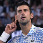 
              Novak Djokovic of Serbia reacts after winning the first set against Tommy Paul of the U.S. during their semifinal at the Australian Open tennis championship in Melbourne, Australia, Friday, Jan. 27, 2023. (AP Photo/Aaron Favila)
            