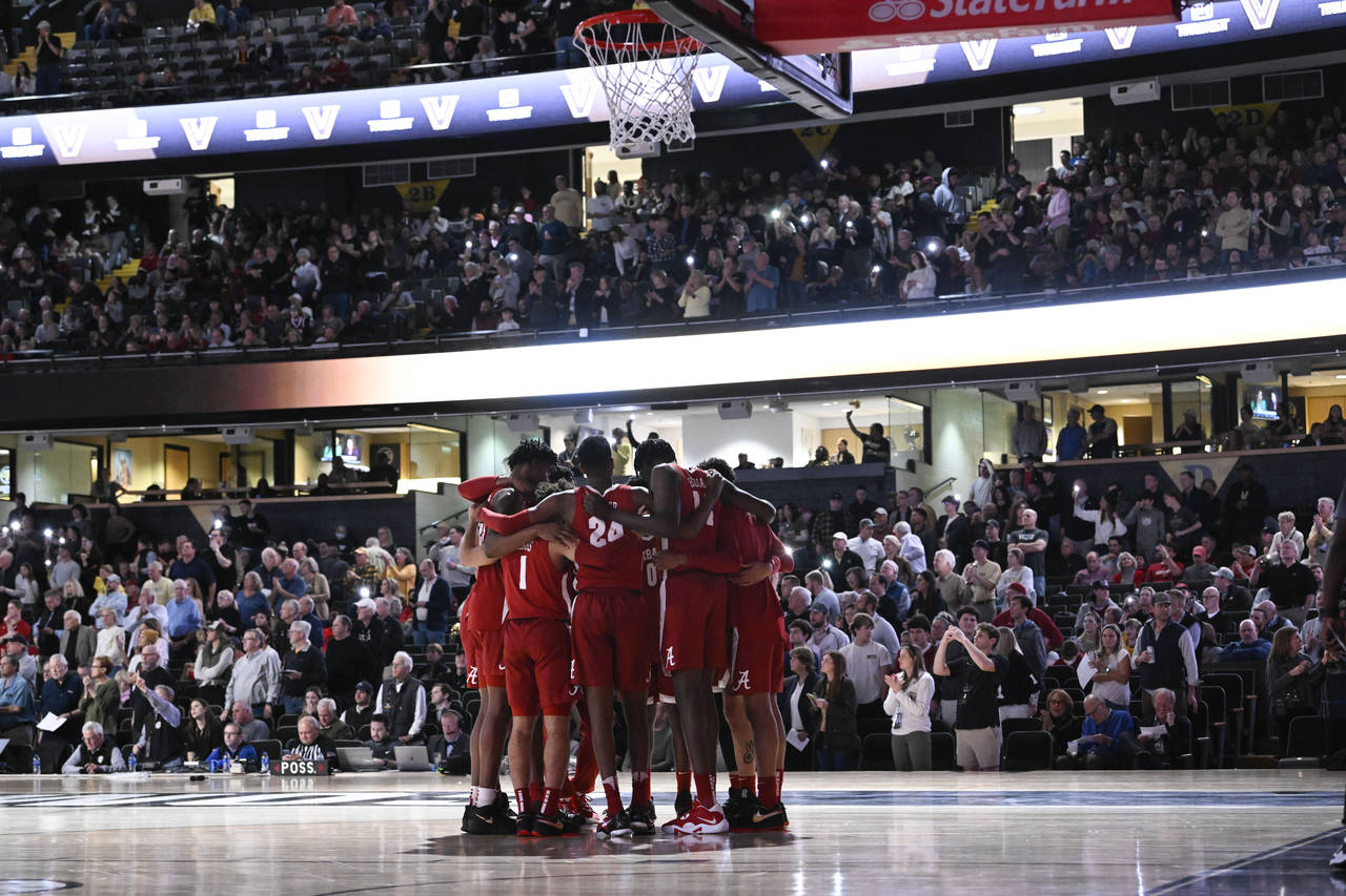 Alabama players huddle before an NCAA college basketball game against Vanderbilt on Tuesday, Jan. 1...