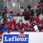 
              Montreal Canadiens players and coaches look on from the bench during the closing seconds of third-period NHL hockey game action against the New York Rangers in Montreal, Thursday, Jan. 5, 2023. (Graham Hughes/The Canadian Press via AP)
            